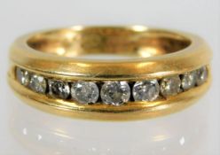 An 18ct half eternity ring set with 0.5ct diamond