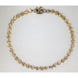 A 14ct gold tennis bracelet set with 4ct diamonds