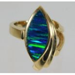 A 14ct gold ring with opalescent style stone 8.6g