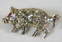 A .900 silver pig brooch