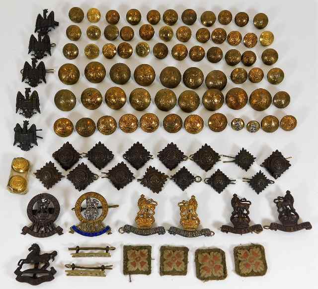 A quantity of brass buttons & various badges, some