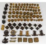 A quantity of brass buttons & various badges, some