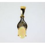 A 9ct mounted opal pendant with three small diamon
