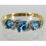 A 9ct gold diamond & topaz ring 2g size P