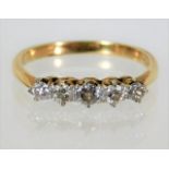An 18ct gold five stone diamond ring approx. 0.45c