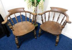 A pair of 19thC. elm smokers chairs