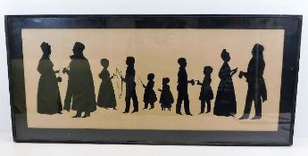 A framed 19thC. family silhouette group, size 30.2