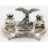 A 19thC. silver plated ink stand with eagle finial