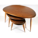 A mid 20thC. Ercol nest of pebble shaped tables