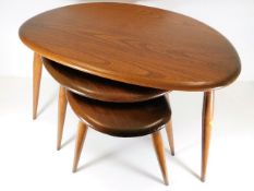 A mid 20thC. Ercol nest of pebble shaped tables