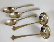 A pair of silver ladles twinned with three silver