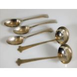 A pair of silver ladles twinned with three silver