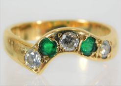 An 18ct gold ring set with emerald & diamond 4g si