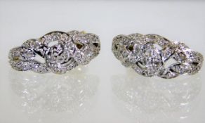 A pair of 9ct gold earrings set with diamonds 4.6g