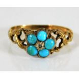 A yellow metal Victorian ring set with natural tur