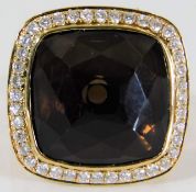 An 18ct gold smokey quartz & 0.6ct diamond ring 16