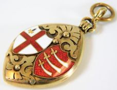 A 15ct gold Victorian locket with enamelled shield