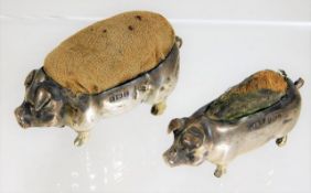 Two silver Victorian pig pin cushions. Provenance: