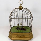 A brass caged automaton featuring singing & moving
