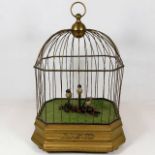 A brass caged automaton featuring singing & moving