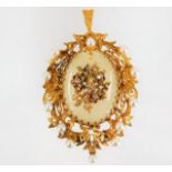 A 9ct gold pendant mounted on chalcedony & set wit