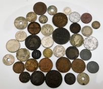 A bag of mixed coinage including a penny token