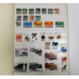 An album of world stamps including China, France &