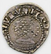 A small English silver coin with rose to verso 13.