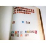 A large stamp album 17.5in x 14.75in x 3in of many