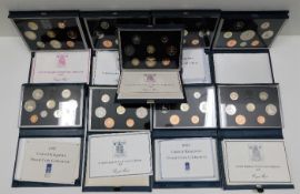 Nine Royal Mint coin sets in cases