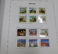 A large Alderney stamp album, mint & used