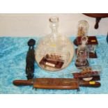 A selection of glass ships in bottles twinned with
