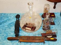 A selection of glass ships in bottles twinned with