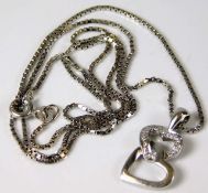 A 9ct white gold necklace with a diamond heart pen