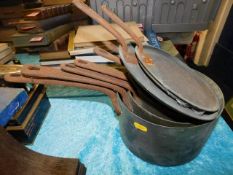 Four copper saucepans with lids