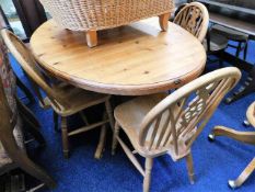 A pine dining table with four chairs