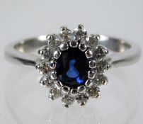 A 14ct white gold ring set with sapphire & 0.28ct