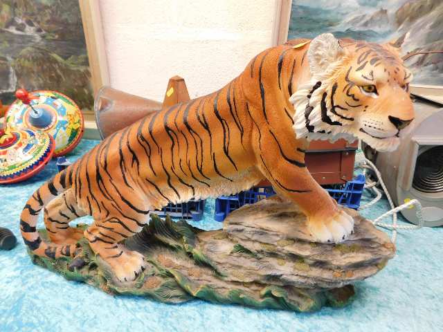 A large resin model of a tiger