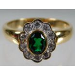 A 9ct gold ring set with diamond & tourmaline size