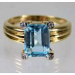 A 9ct gold ring set with topaz & diamonds size N/O