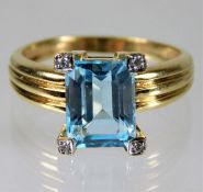 A 9ct gold ring set with topaz & diamonds size N/O