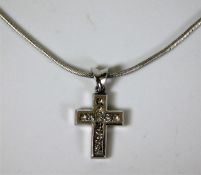 An 18ct gold cross & chain set with approx. 0.5ct