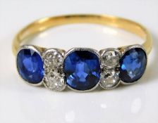 An antique 18ct gold ring set with three sapphires