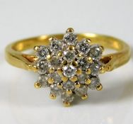 An 18ct gold cluster ring set with 0.5ct diamond s