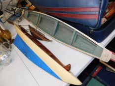 Two large model boat hulls & one other
