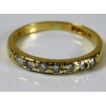 An 18ct gold seven diamond ring size M/N 2.1g