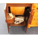 An oak electric sewing machine with cabinet