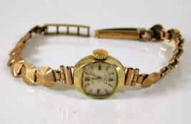 A 9ct gold watch including strap 11.3g