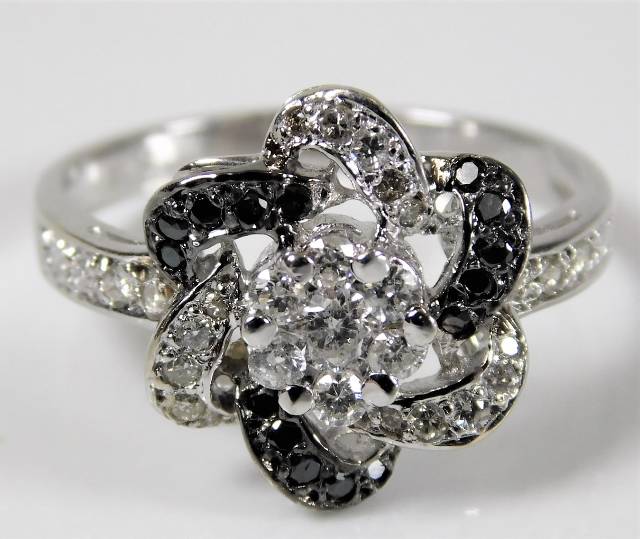 A 14ct white gold ring set with black & white diam