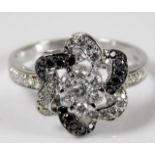 A 14ct white gold ring set with black & white diam